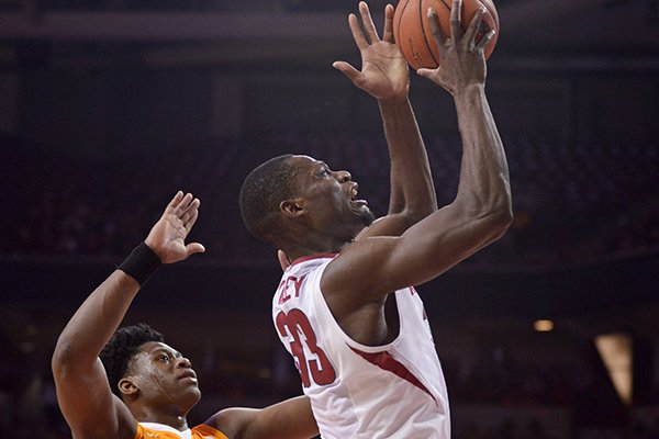 Moses Kingsley of Arkansas makes a basket over Admiral Schofield of Tennessee on Saturday, Feb. 6, 2016, during the game in Bud Walton Arena in Fayetteville.