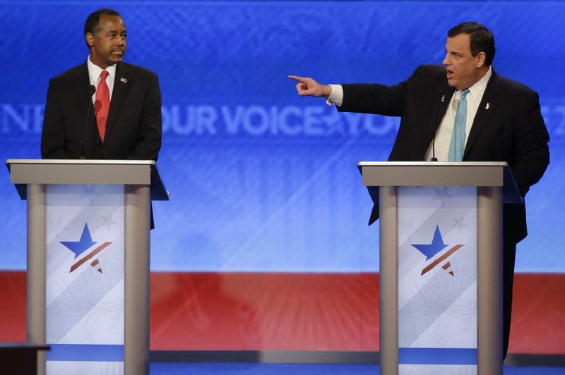 New Jersey Gov. Chris Christie points past Ben Carson at GOP presidential rival Marco Rubio during Saturday night’s debate, accusing him of “truancy” for missing key Senate votes.