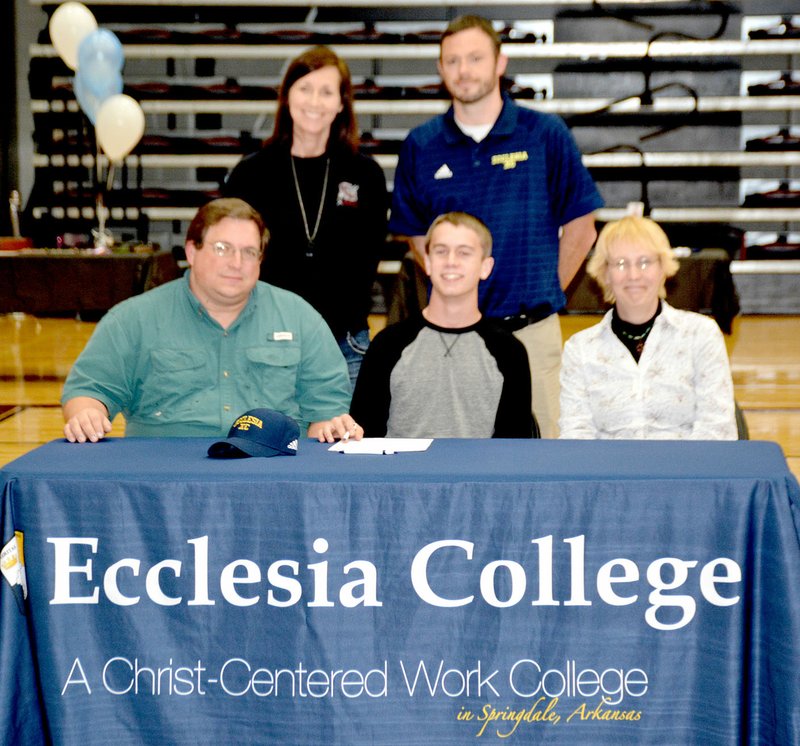 Graham Thomas/Siloam Sunday Siloam Springs senior Aaron Capehart signed a letter of intent to run cross country and track at Ecclesia College in Springdale. Pictured are, from left, father Joel Capehart, Aaron Capehart and mother Kamela Capehart; back, Siloam Springs cross country coach Sharon Jones and Ecclesia coach Lee Wood.