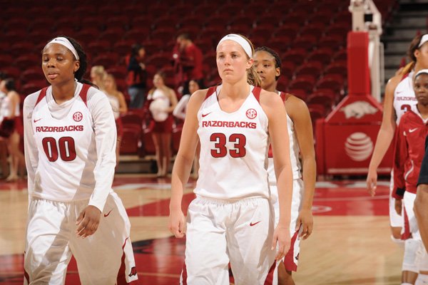 Jessica Jackson (00) and Melissa Wolff (33) of Arkansas walk off the floor against Florida Thursday, Jan. 28, 2016, after overtime in Bud Walton Arena. Visit nwadg.com/photos to see more photographs from the game.