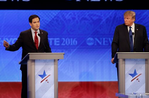 Republican presidential candidate Sen. Marco Rubio, R-Fla., answers a question as Republican presidential candidate, businessman Donald Trump, listens during a Republican presidential primary debate hosted by ABC News at the St. Anselm College on Saturday, Feb. 6, 2016.