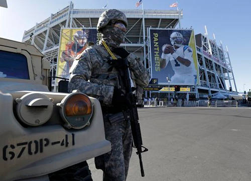 Military personnel stand guard outside Levi's Stadium before the Super Bowl game between the Denver Broncos and the Carolina Panthers on Sunday, Feb. 7, 2016, in Santa Clara, Calif.