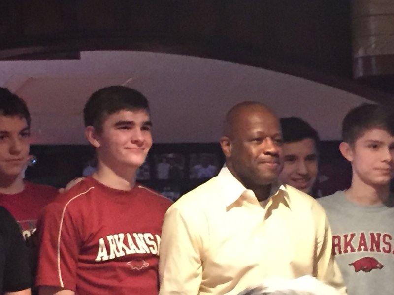 It’s blurry, but it’s proof! Razorbacks basketball Coach Mike Anderson poses with fans at Herman’s Ribhouse in Fayetteville. 