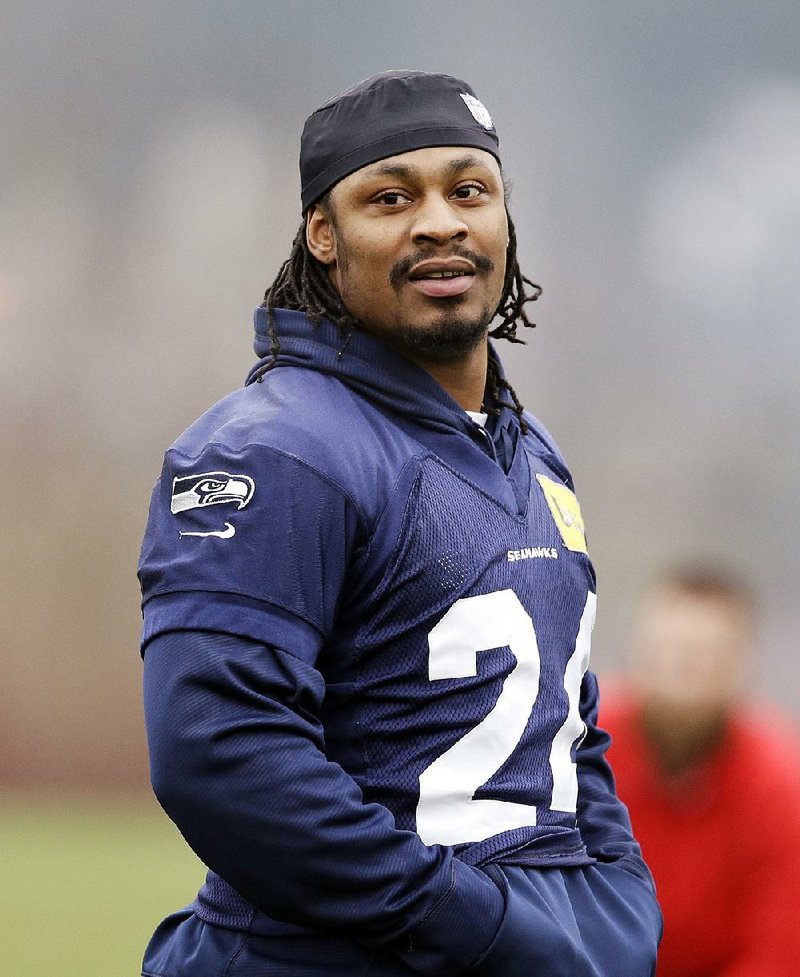 Seattle Seahawks' Marshawn Lynch walks on the field at an NFL football practice Thursday, Jan. 16, 2014, in Renton, Wash. 