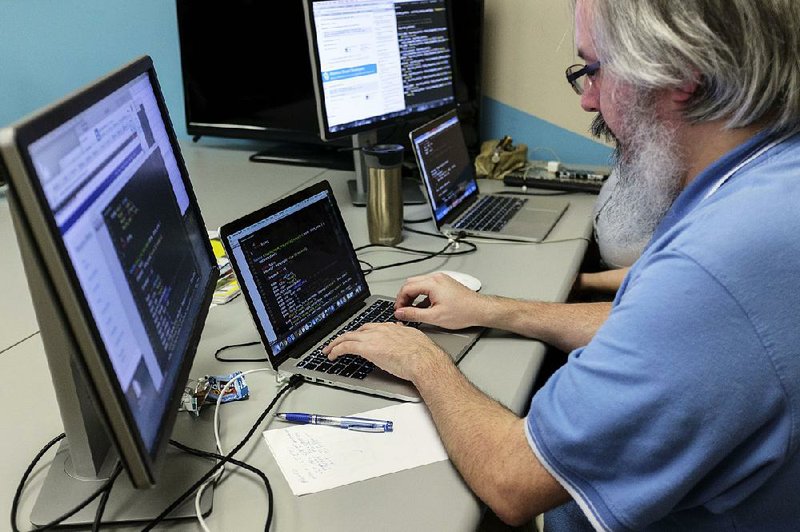 Employee Shawn Hopkins works on a coding project at the Bit Source LLC office in Pikeville, Ky. 