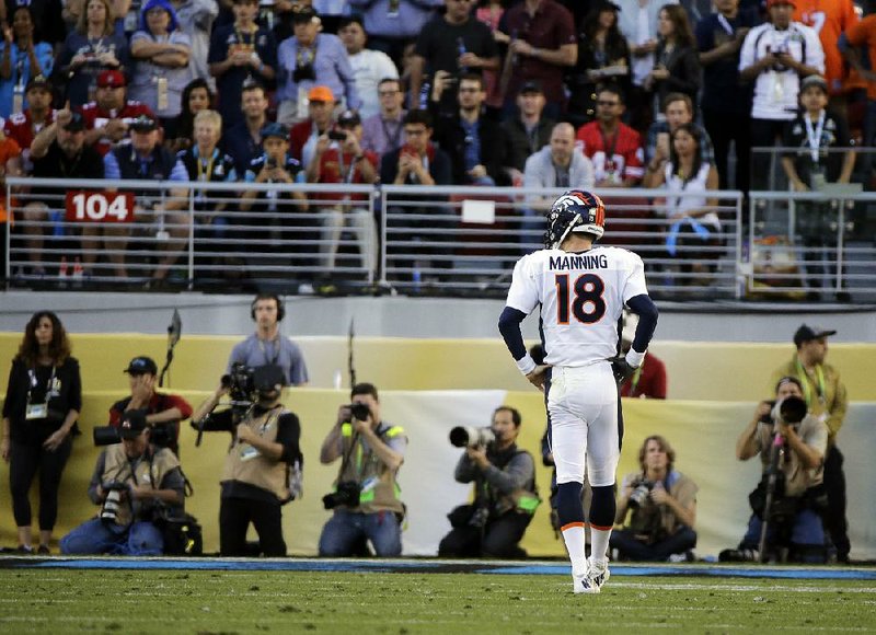 Denver Broncos quarterback Peyton Manning walks off the field between plays during the first half. Sunday’s 24-10 victory over the Carolina Panthers in Super Bowl 50 marked the end of Manning’s 18th season in the NFL, and perhaps his last.