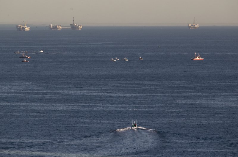 Rescue boats search for wreckage from two small planes that collided in midair and plunged into the ocean off of Los Angeles harbor Friday, Feb. 5, 2016, in San Pedro, Calif. There was no immediate word of any survivors, authorities said. 