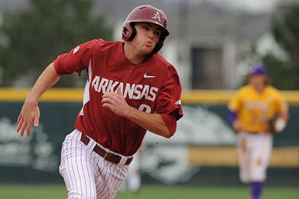 Clark Eagan of Arkansas rounds third to score a run against LSU during the fifth inning Saturday, March 21, 2015, at Baum Stadium in Fayetteville.