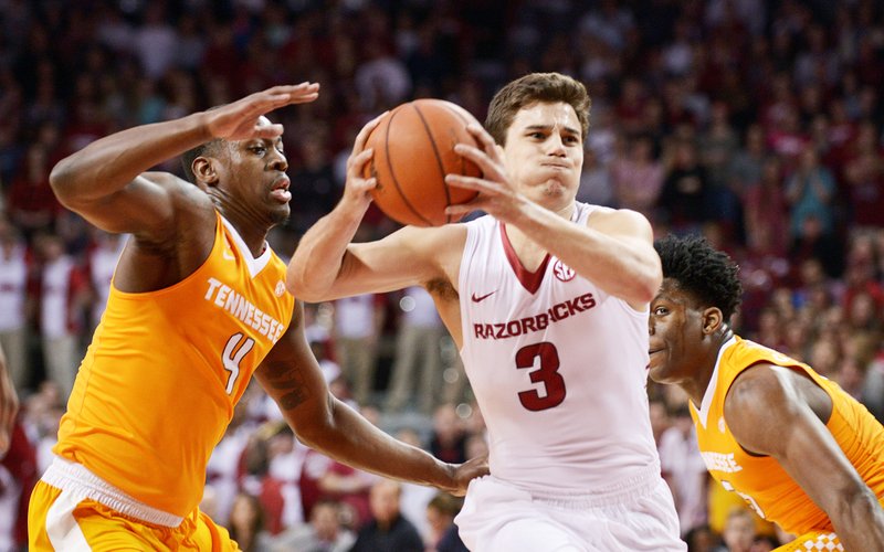 NWA Democrat-Gazette/Ben Goff HIGH-POINT HANNAHS: Arkansas guard Dusty Hannahs drives to the basket as Tennessee guard Armani Moore defends during Saturday’s 85-67 Razorback victory at Walton Arena in Fayetteville. Hannahs scored a game-high 26 points during the Hogs’ 82-68 home victory over Mississippi State on Jan. 9, Arkansas visiting the Bulldogs at 8 o’clock tonight on the SEC Network (Resort Channel 79).