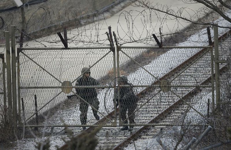 South Korean army soldiers close a gate Monday in Paju, near the border with North Korea.