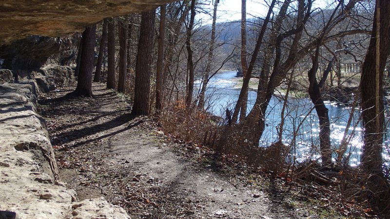The River Trail at Roaring River State Park runs for 1.1 miles along spring-fed Roaring River in the Missouri State Park for a 2.2-mile out and back hike.