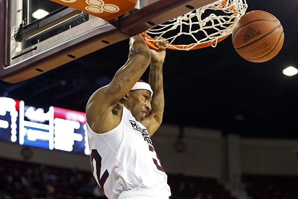 Mississippi State guard Craig Sword (32) dunks against Arkansas in the first half of an NCAA college basketball game in Starkville, Miss., Tuesday, Feb. 9, 2016. (AP Photo/Rogelio V. Solis)
