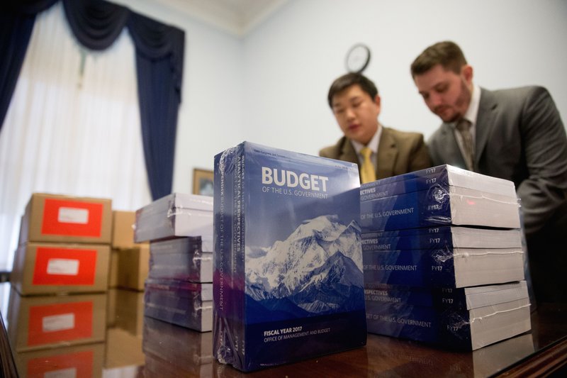 Copies of the President Barack Obama's fiscal 2017 federal budget are unpacked after being delivered to the House Budget Committee Room on Capitol Hill in Washington, Tuesday, Feb. 9, 2016. President Barack Obama unveils his eighth and final budget, a $4 trillion-plus proposal that’s freighted with liberal policy initiatives and new and familiar tax hikes, sent to a dismissive Republican-controlled Congress. (AP Photo/Andrew Harnik)
