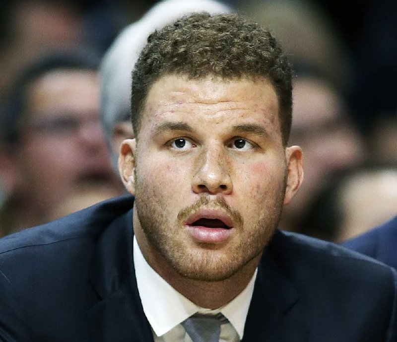 This Jan. 13, 2016, file photo shows Los Angeles Clippers' Blake Griffin on the bench during the first half of an NBA game against the Miami Heat, in Los Angeles. 