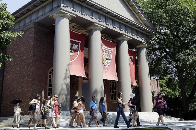 A tour group walks through the campus of Harvard University in Cambridge, Mass., in this file photo. Harvard University has the largest U.S. school endowment, at $37.6 billion.