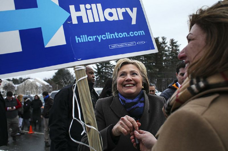Hillary Clinton, a Democratic presidential hopeful, greets supporters outside a polling station at Gilbert Hood Middle School in Derry, N.H., Feb. 9, 2016. Voters will pour into their polling places in New Hampshire Tuesday for the first primary election of the 2016 presidential campaign. (Richard Perry/The New York Times)