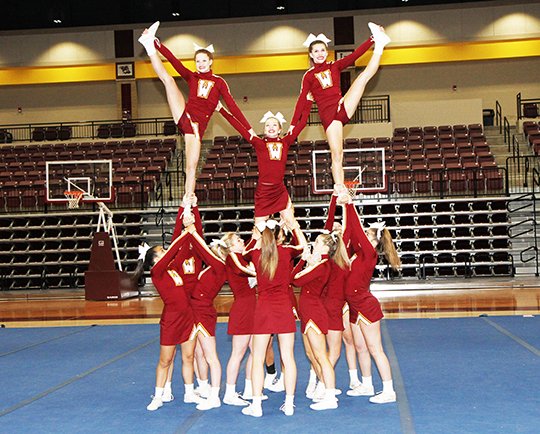 The Sentinel-Record/Lorien E. Dahl BIG FINISH: Lake Hamilton Junior High cheerleaders perform during a send-off routine Feb. 10 at Lake Hamilton Wolf Arena. The team earned second place in their division at UCA nationals in Florida on Saturday.