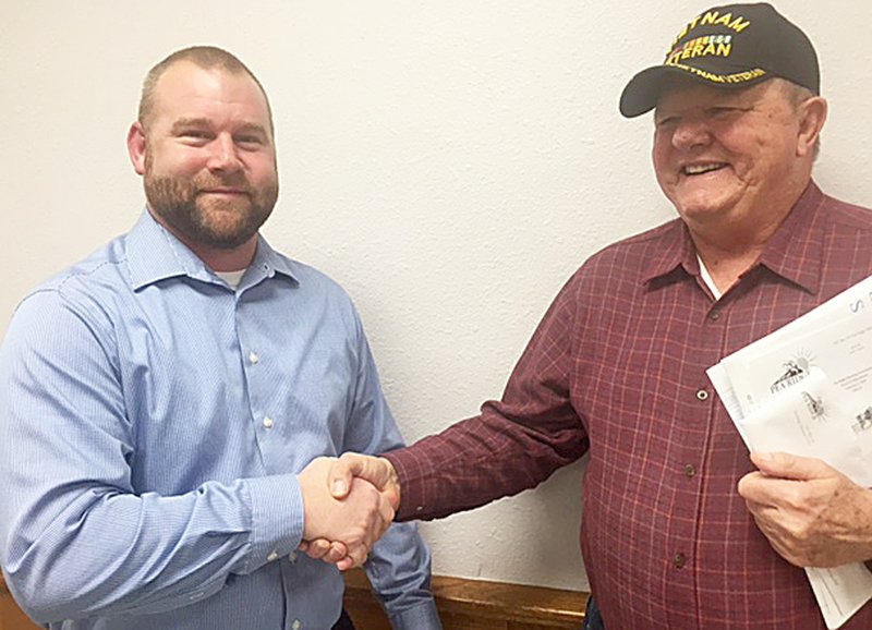 TIMES photograph by Annette Beard Chris Johnson, left, was approved by Pea Ridge Planning Commission members for recommendation to the Pea Ridge City Council to fill one of two vacancies on the board. Planner Jerry Burton welcomed Johnson after Tuesday night&#8217;s meeting.