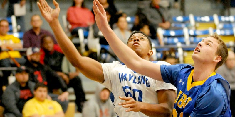 Photo courtesy of Wayland Baptist University John Brown freshman Ben Smith, right, battles Wayland Baptist&#8217;s Marquous Barnes during Saturday&#8217;s game in Plainview, Texas.