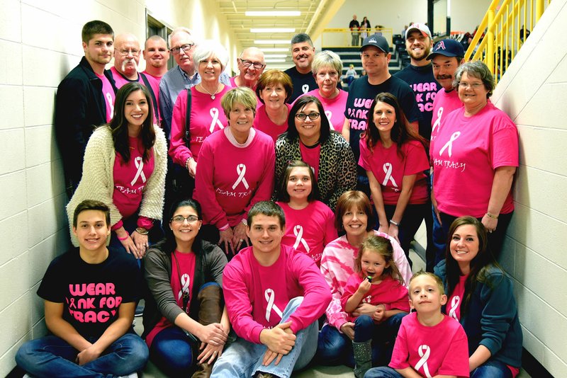 Photo courtesy of Shelley Williams/Tracy Tice, seated and wearing a tie-dyed shirt, is surrounded by family members during a Pink Out for Tracy Tice fundraiser in Prairie Grove on Feb. 5.