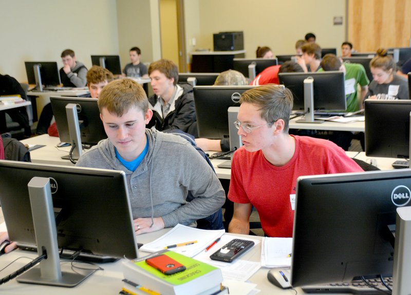 Janelle Jessen/Herald-Leader John Brown University students Zach Lee and Ken McDonell worked together during the Computer Programming Competition on Saturday morning.