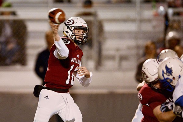 Jack Lindsey, Springdale quarterback, throws a pass on Friday Nov. 6, 2015 during the game against Rogers in Springdale's Jarrell Williams Bulldog Stadium.