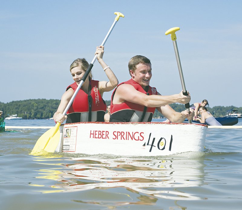 Destany Lytle and Paul Harmon paddle toward the finish line in the 2015 World Championship Cardboard Boat Races, held in July in Heber Springs. The annual event, sponsored by the Heber Springs Area Chamber of Commerce, was named 2015 Event of the Year in Arkansas by the Arkansas Festivals & Events Association.