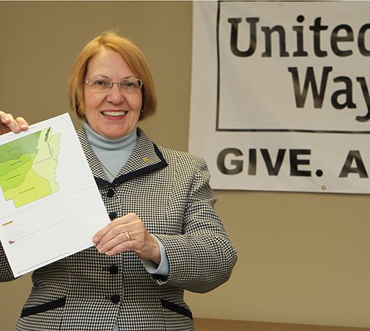 The Sentinel-Record/Richard Rasmussen NAME CHANGE PLANNED: Jane Browning, executive director of the United Way of Garland County, displays a map of Arkansas showing the states various geological areas from which the agency picked its new name "United Way of the Ouachitas" to reflect the area in which it serves.