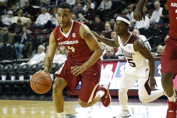 Arkansas guard Jabril Durham (4) is pursued by Mississippi State guard I.J. Ready (15) in the first half of an NCAA college basketball game in Starkville, Miss., Tuesday, Feb. 9, 2016. Mississippi State won 78-46. (AP Photo/Rogelio V. Solis)