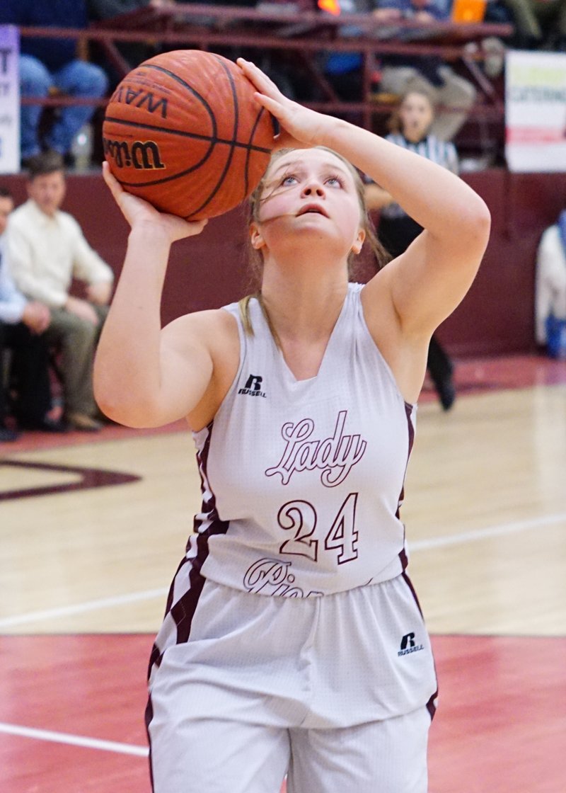 Brieann Ward, Gentry senior shoots from under the basket during a recent game at Gentry High School.