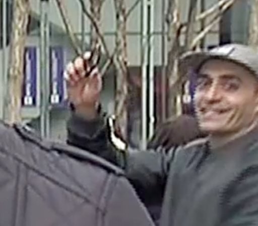 In this image taken from WNBC-TV video, a man appears to wave a handgun behind a television news reporter during a live broadcast in New York City on Wednesday, Feb. 10, 2016.