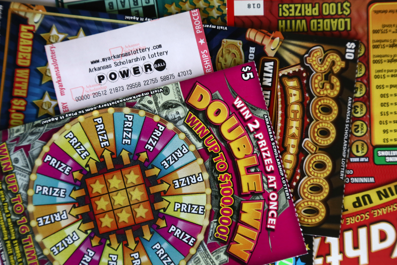 FILE — Arkansas Lottery Scholarship scratch-off cards and Powerball ticket.
