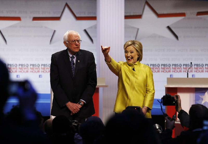 Bernie Sanders and Hillary Clinton take the stage for Thursday’s Democratic presidential primary debate in Milwaukee.