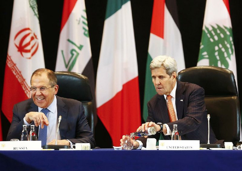 U.S. Secretary of State John Kerry (right) and Russian Foreign Minister Sergey Lavrov attend the International Syria Support Group meeting in Munich on Thursday, together with members of the Syrian opposition and other officials. 