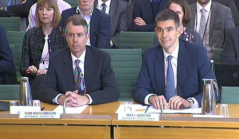 In this image made from video, Google Vice President Tom Hutchinson, left, and President of Google Europe, Middle East and Africa, Matt Brittin, give evidence to the British government Commons Public Accounts Committee in London, Thursday Feb. 11, 2016. The executives are appearing before the government committee following controversial agreements over tax payments by the internet giant. 