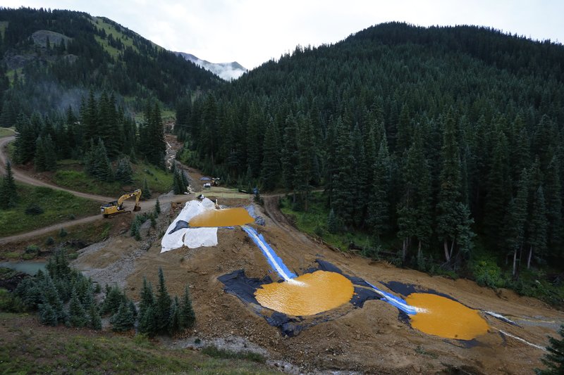 Water flows Aug. 12 through a series of retention ponds built to contain and filter out heavy metals and chemicals from the Gold King mine chemical accident in the spillway about one-quarter of a mile downstream from the mine outside Silverton, Colo.