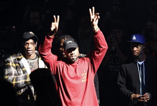 Kanye West gestures to the audience at the unveiling of the Yeezy collection and album release for his latest album, "The Life of Pablo," on Thursday, Feb. 11, 2016 at Madison Square Garden in New York.