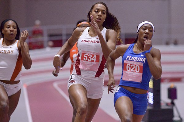 Taylor Ellis-Watson (534) of Arkansas follows Robin Reynolds (620) of Florida in their heat in the 400 meter dash Friday, Feb. 12, 2016, during the Tyson Invitational track meet at the Randal Tyson Track Center in Fayetteville. Ellis-Watson won the event with a time of 52.18 seconds.