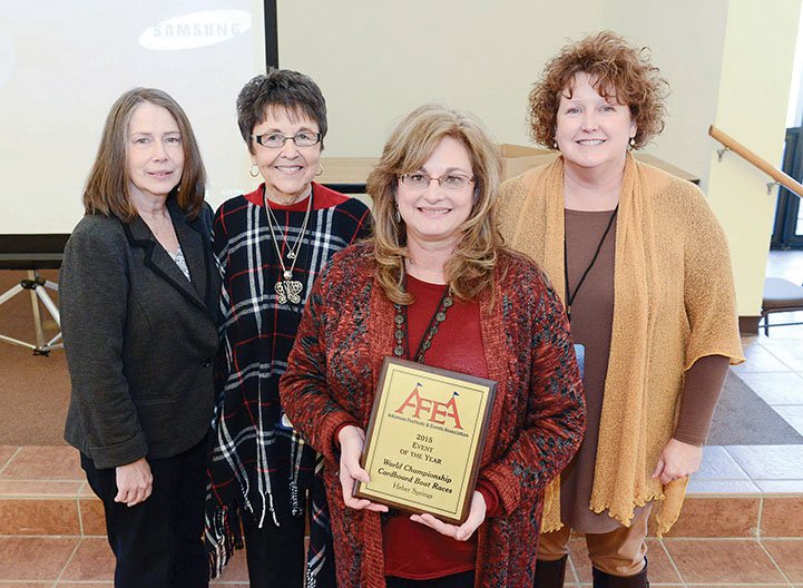 Theresa Bobo holds the Event of the Year plaque the Heber Springs Area Chamber of Commerce received for its World Championship Cardboard Boat Races. The award was given by the Arkansas Festivals & Events Association at its conference Jan. 27 and 28 in Little Rock. Also pictured from the chamber, from left, are Arlene Anderson, Ina Brown and Julie Murray, executive director.