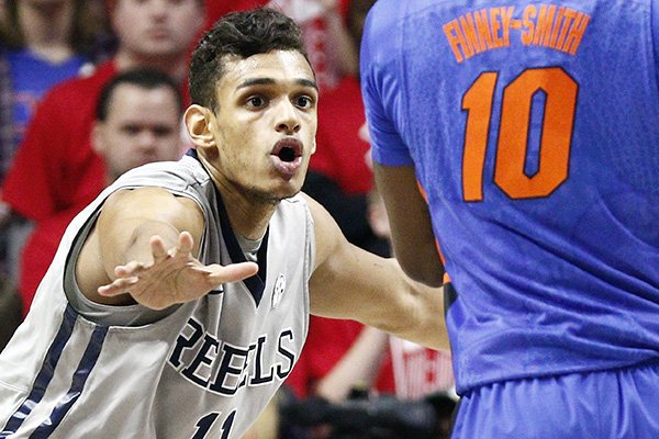 In this Jan. 16, 2016, photo, Mississippi forward Sebastian Saiz (11) defends against Florida forward Dorian Finney-Smith (10) in an NCAA college basketball game in Oxford, Miss. Saiz, barely three weeks removed from eye surgery to repair a partially detached retina, returned to the court Tuesday, Feb. 9 and played for 26 minutes. The Rebels hope their second-leading scorer can provide a boost for the team in the season's final month. (AP Photo/Rogelio V. Solis)