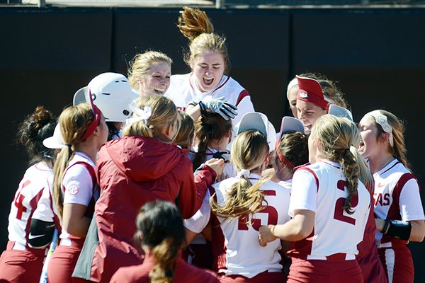 Arkansas players celebrate after beating North Dakota State on a walk-off home run on Friday, Feb. 12, 2016, in Austin, Texas. 