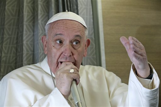 Pope Francis speaks to reporters aboard the plane during the flight from Rome to Habana, Cuba, on his way to a week-long trip to Mexico, on Friday, Feb. 12, 2016.