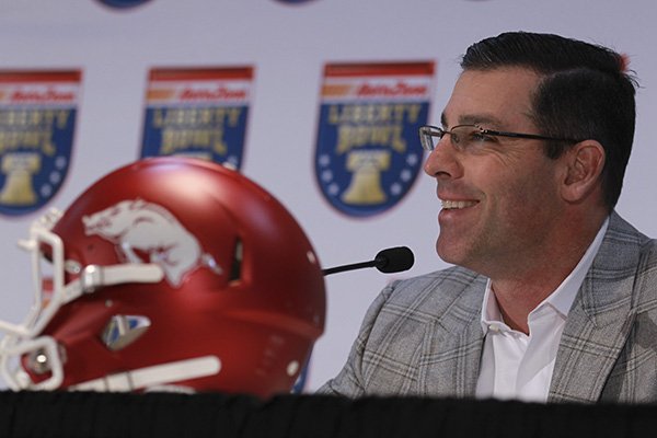 Arkansas offensive coordinator Dan Enos speaks to the media during a press conference Thursday, Dec. 31, 2015, at the Embassy Suites hotel in Memphis, Tenn. 
