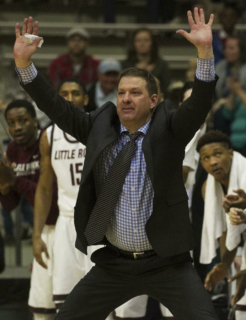 UALR coach Chris Beard signals his team during the Trojans game against Georgia State Saturday at the Jack Stephens Center in Little Rock.