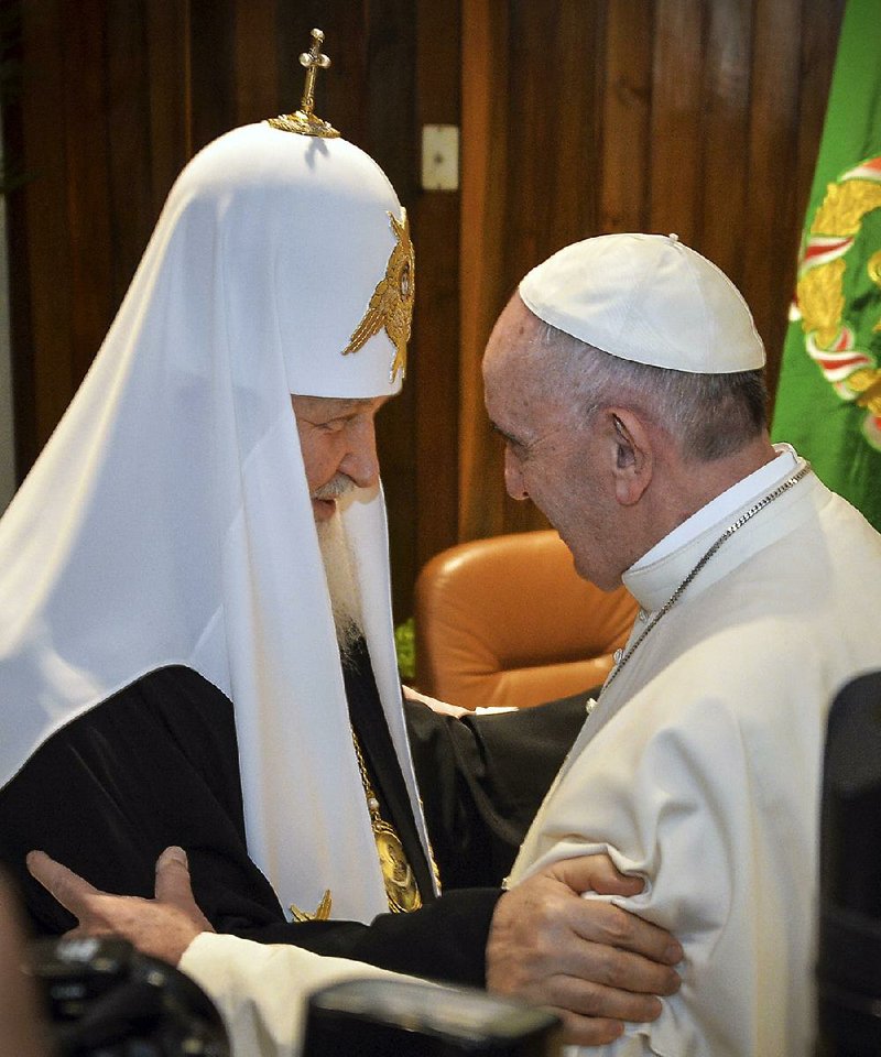 Patriarch Kirill, head of the Russian Orthodox Church, greets Pope Francis on Friday at Jose Marti Airport in Havana. The meeting was the fi rst ever for a pontiff and the head of the Russian church. “We are brothers,” the pope said at the start of the three-hour encounter.