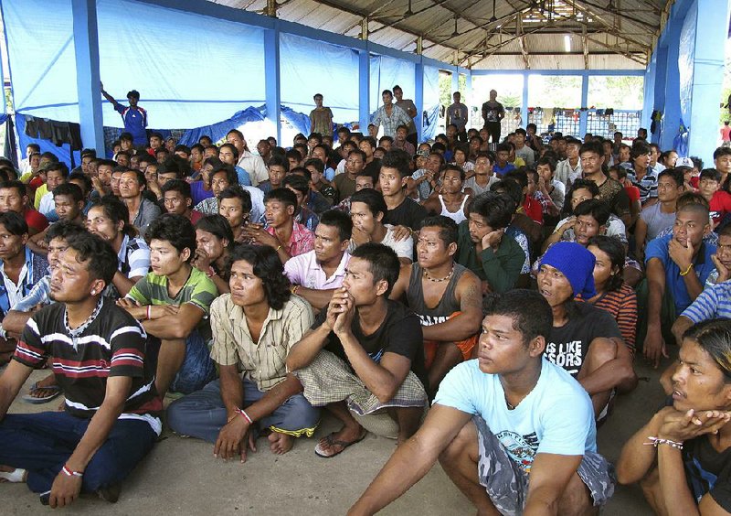 People once held as enslaved fishermen on a remote Indonesian island gather at a temporary shelter last year after they were rescued by the government. 