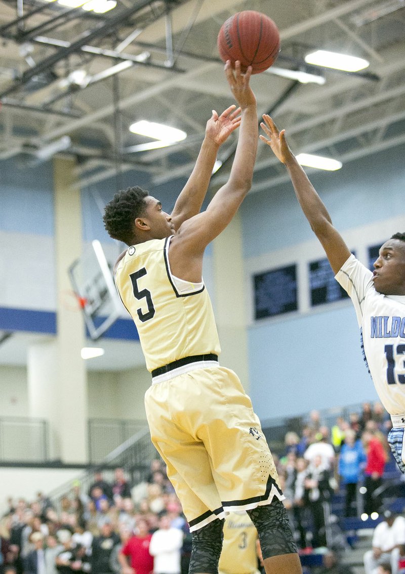 Malik Monk of Bentonville goes up for a 3-point shot as Tevin Eckwood of Ha-Ber attempts to block the shot at Har-Ber High School, Springdale, AR, on Friday, February 12, 2016. - Bentonville at Springdale Har-Ber, 7A Division basketball game.