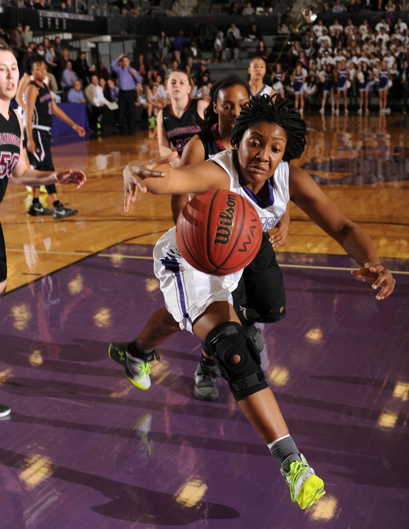  Jasmine Franklin of Fayetteville reaches for the ball Friday as Maya Hood of Springdale High in the first half at Bulldog Arena in Fayetteville. Visit nwadg.com/photos to see more photographs from the game.