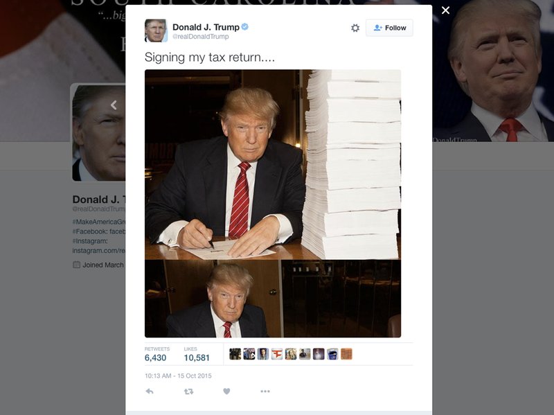 This image from Republican presidential candidate Donald Trump's campaign shows Trump signing his tax return.  