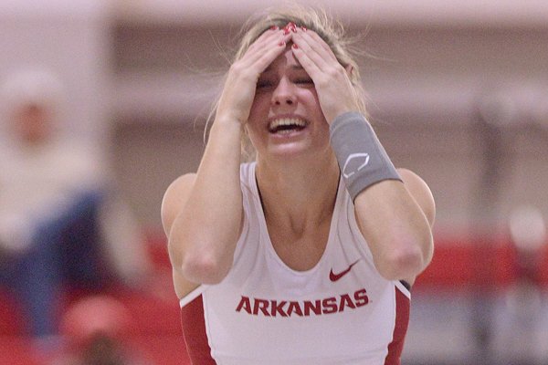 Arkansas' Lexi Weeks reacts after clearing the bar at 15 feet, 1 inch on her second attempt on Saturday, Feb. 13, 2016, while competing in the pole vault during the second day of the Tyson Invitational indoor track meet at the Randal Tyson Track Center in Fayetteville. Weeks placed second in the event with the jump. 